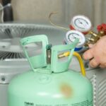 HVAC technician checking refrigerant levels